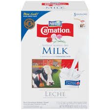 Carton of Carnation evaporated milk with cow image.